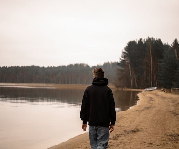 A serene landscape with a calm lake reflecting the sky, representing mental clarity.