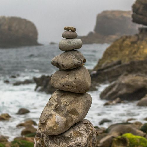 Stacked stones on a blurred background, symbolizing balance and harmony in life.
